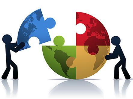 earth-puzzle Two people work together to make the earth from puzzle pieces